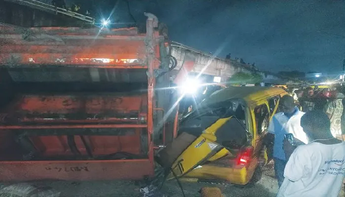 Tragic Accident In Lagos: Refuse Truck Plunges Off Bridge, Fatally Strikes Tricycle Rider